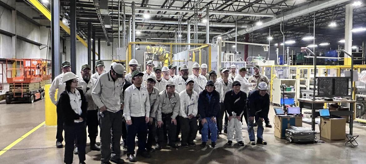 A group of people in white shirts and hats